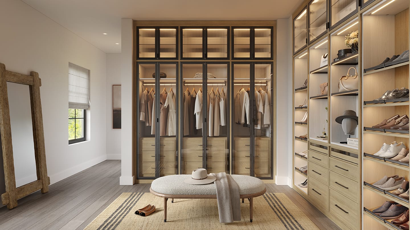 Customized walk in closet cabinetry, closthes hanging areas and shoe storage by California Closets