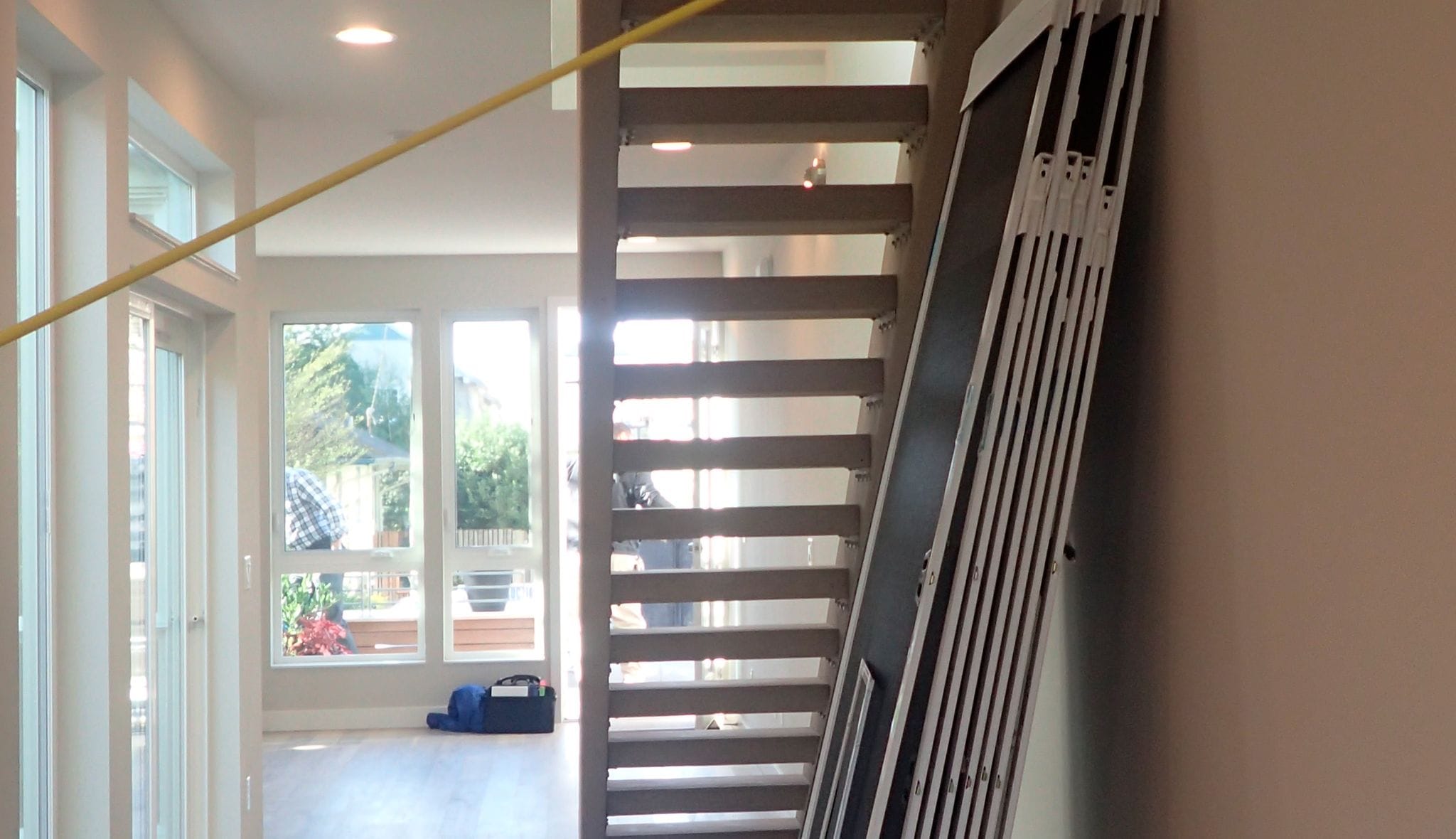 Before remodeling of a kitchen pantry addition under the stairs by California Closets