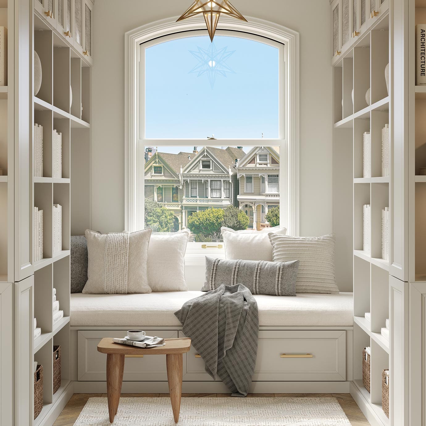 Custom library reading space bench area next to window with bookshelves by California Closets