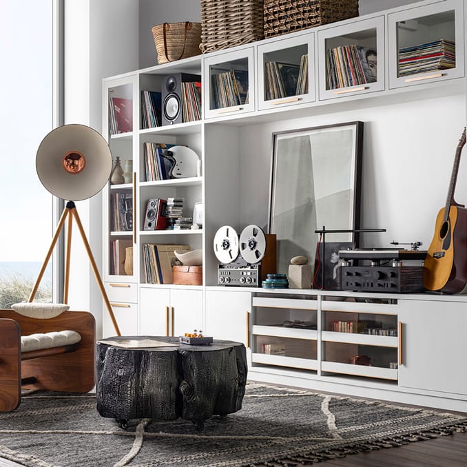 Living room media storage with custom shelving design in a white finish by California Closets